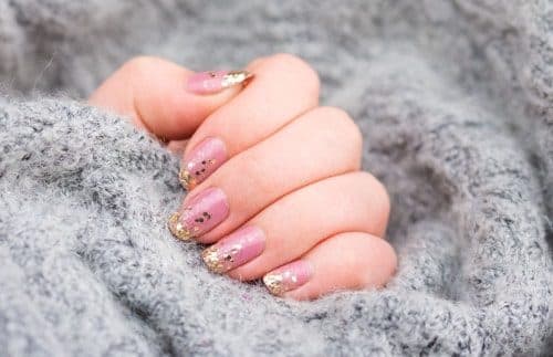 Pink nails with gold flakes
