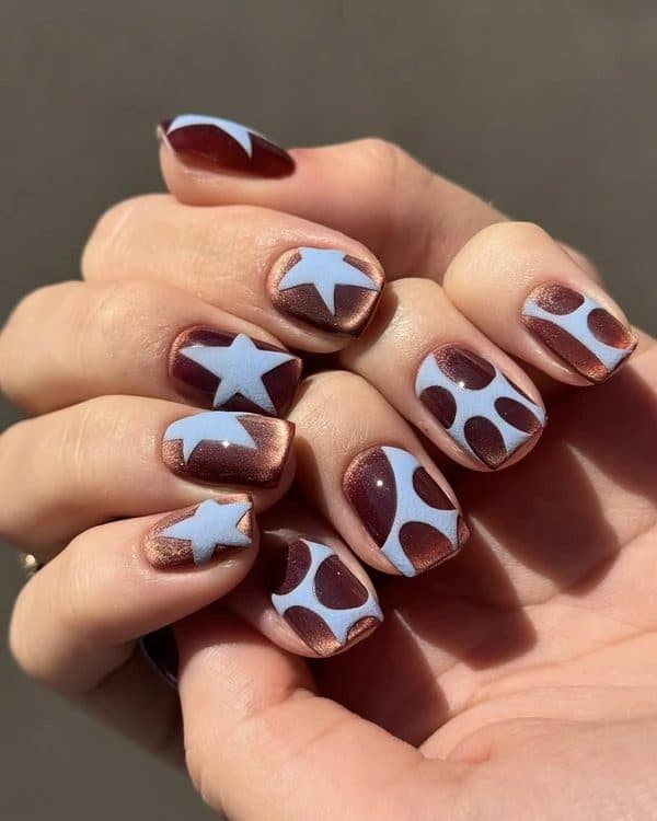 Baby-blue stars on burgundy nails